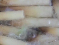 Vegetables are cooked in the pan from right to left. Stock Footage