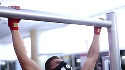 Muscular Men Doing Chin-Ups in the Gym with oxygen mask Stock Footage