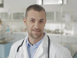 Man In Lab Coat Talking At Camera Stock Footage