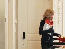 mother taking a bag of potato chips from her daughter and replacing it with an apple Stock Footage