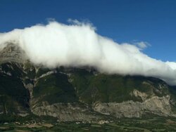 AERIAL WS White cloud floating above mountain in Maritime Alpes / Rhone-Alpes, France Stock Footage