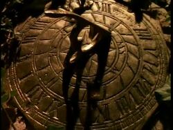 T/L Sundial, with ivy around edges, shadow moves around timepiece Stock Footage