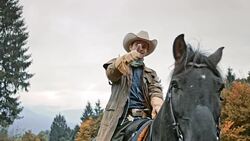 SLO MO Herdsman sitting on horse doing thumb up Stock Footage