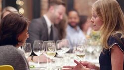 MS Two women in discussion during dinner party Stock Footage