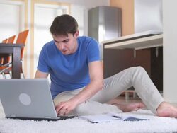 HD DOLLY: Young Student Using Computer For Homework Stock Footage