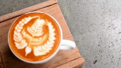 HD:Coffee with art latte on the table of coffee shop Stock Footage