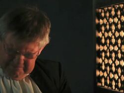 Priest drinking alchohol/wine in confession Stock Footage