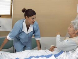 HD DOLLY: Nurse Making The Bed Stock Footage