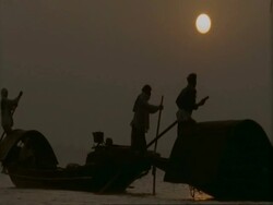 MS Silhouetted men in fishing boats, in misty mangrove swamp, Sunderbans, India Stock Footage