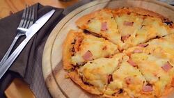 Hawaiian pizza served on a wooden tray Photo Brown. Stock Footage