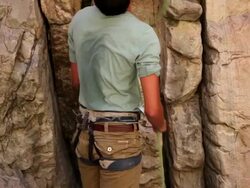 Tilt shot of a man adjusting a locking carabiner. Stock Footage