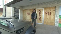 Boarded up hair salon in Ferguson after riots News Clip