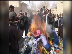 Residents in the Afghan city of Ghazni on burned blankets, clothing and other items that they said coalition troops had distributed in the city the day before, while Afghan President Hamid Karzai works to reduce the foreign presence in the country. News Clip