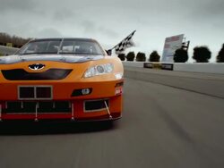 LA TS WS PAN Racecar driver holding checkered flag out car window while driving on racetrack / Long Pond, Pennsylvania, USA Stock Footage