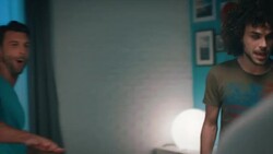 Guys playing tabletop soccer in apartment Stock Footage