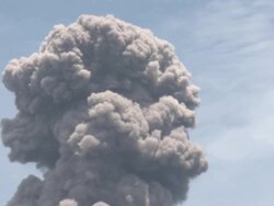 Zoom out of large erupting ash cloud from Anak Krakatau volcano, Krakatoa, Indonesia, November 2010 Stock Footage