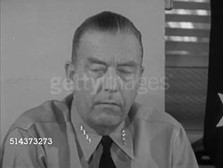 1953: HAWAII: TU WS 'Headquarters, Commander in Chief, Pacific & US Pacific Fleet' sign, Admiral Arthur W. Radford (1896-1973) sitting at desk, SOT saying important military base, west coast defenses, finest harbor, mild climate for training. Instructional Video