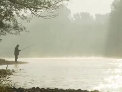 HD: Fishing By The Misty River Stock Footage
