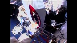 Olympic torch is taken on spacewalk News Clip