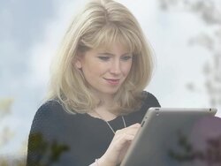 Tablet girl, window reflections. Stock Footage