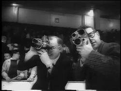 B/W 1961 2 men holding small film cameras at Stanley Cup / Detroit / newsreel Stock Footage