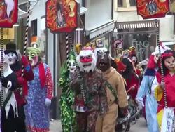 MS Shot of masked people walking on street and celebrating in Basel Carnival (Basler Fasnacht) / Basel, Switzerland Stock Footage