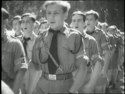 Teenage boys in Hitler's Youth Army march and sing songs in harmony. News Clip