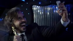 Celebrity poses for selfies in backseat of limousine and kisses Oscar statuette at awards show Stock Footage