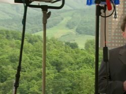CU PAN Shot of television news crews working outside during G8 meeting / Hokkaido Toyako, Japan Stock Footage