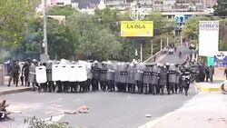 CLEAN : Police fire tear gas and water cannon during protest in Honduras News Clip