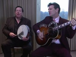 CHRIS Isaak and KENNY DALE JOHNSON singing The Ring Of Fire at Chris Isaak Interview The Royal Garden Hotel on 24th January 2012 in London Stock Footage