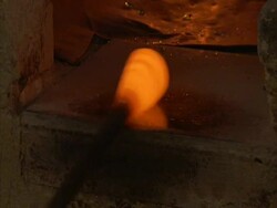 Glass blowing, ball of molten glass rotated on a pole, Egypt (sound available) Stock Footage