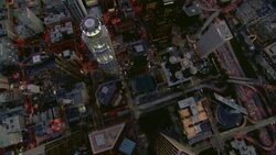 Birds eye view looking down at the skyscrapers of Downtown Los Angeles and the LA Live entertainment complex, in the evening. Stock Footage