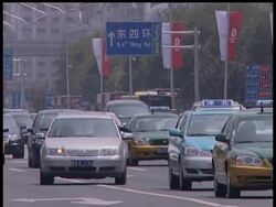 Beijing started its drastic traffic control plan on Sunday in a last-minute push to clear the capital's pollution-choked skies in time for the August Olympics. News Clip