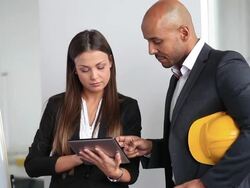Team of architects going over blueprints Stock Footage