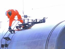 Man in Protection Suit cleaning up after chemical accident Stock Footage