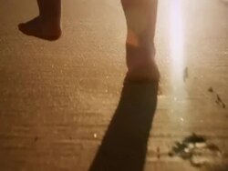 Child walking on beach Stock Footage