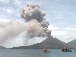 Anak Krakatau erupts large amounts of volcanic ash with boats nearby, Krakatoa, Indonesia, November 2010 Stock Footage