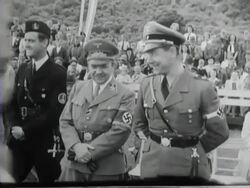 Seyss-Inquart, Schumann and Van Geelkerken give prizes to boys and girls from the Hitler Jugend and the Jeugdstorm Stock Footage