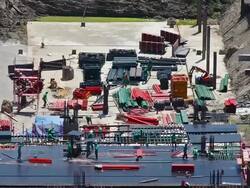 Many builders in action at construction site Stock Footage