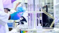 Scientist using microscope and looking a sample Stock Footage