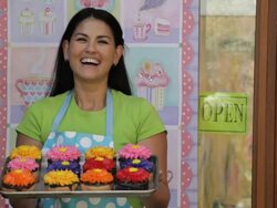 MS Portrait of Bakery Owner Holding Tray of Cupcakes / Richmond, Virginia, USA Stock Footage