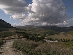 Segesta, people walking to the vallley, the Doric temple on the background Stock Footage