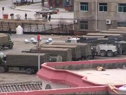 Troops massing in western China News Clip