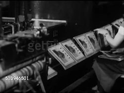 1939: TIME & LIFE CHICAGO:  VS Time Life magazines coming off printing press conveyor line, placing stacks of copies. VS Workers loading packages of magazines onto cargo airplane, trains, steam locomotive moving on rail road track. Distribution Instructional Video