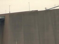 Trailer on suspension bridge Stock Footage