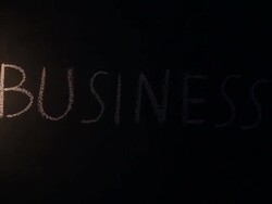 Business text with fire lighting on blackboard Stock Footage