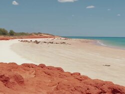 WS PAN View of Gantheaume point with person at beach / Broome, Western Australia, Australia Stock Footage
