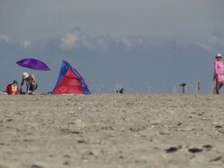 WS Shot of beach camp and windmills, North Sea North Frisia, / St. Peter Ording, Schleswig Holstein, Germany Stock Footage