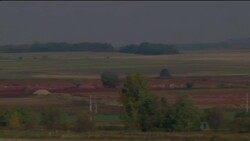 Officials say no new cracks found in red sludge reservoir News Clip